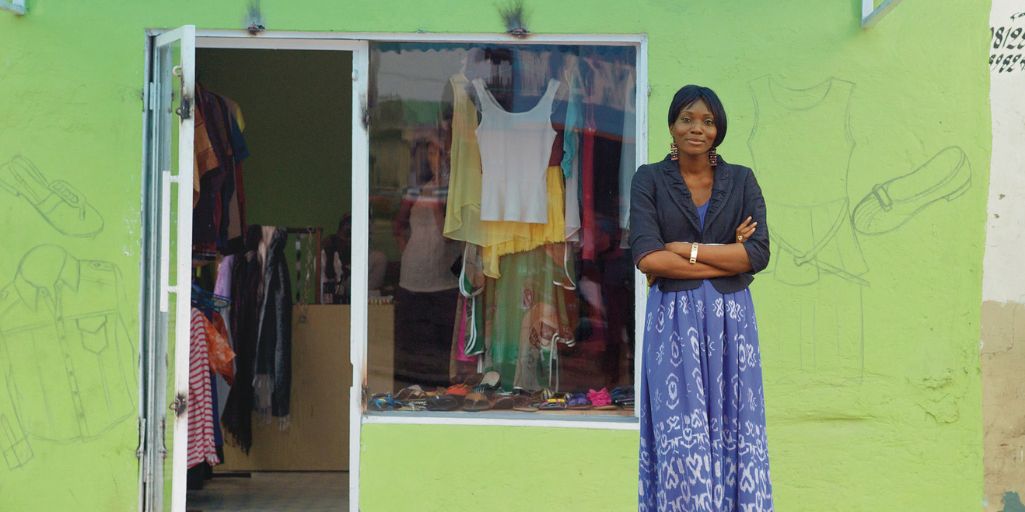 Woman in front of shop